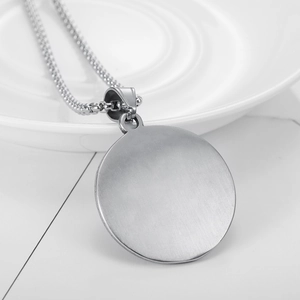 Silver Templar Shield pendant with brushed metal finish on a minimalist pearl chain