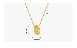 Macro view of 18K gold plated oval pendant and ball chain with measurement details