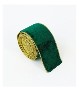 Detailed macro of forest green velvet ribbon with elegant gold metallic edges for decor