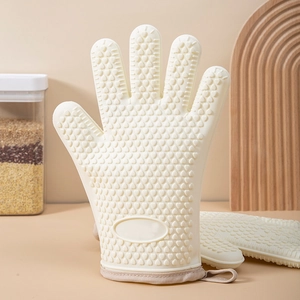 Beige silicone oven mitt with heart-shaped anti-slip texture and cotton fabric cuff