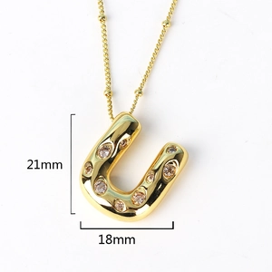 Detailed dimensions of gold U-shaped initial necklace pendant with sparkling crystals