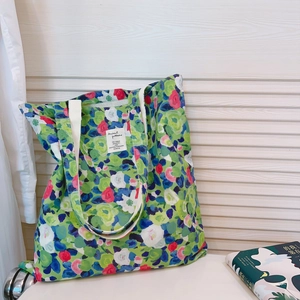 Floral canvas tote bag with green oil painting style print and durable cotton straps