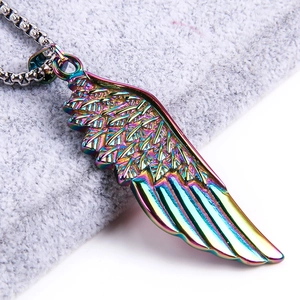 Macro detail of iridescent feather wing pendant with vibrant rainbow metallic finish