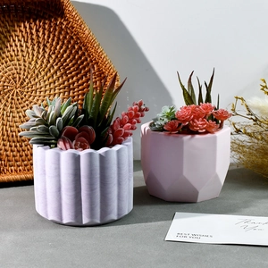Detailed view of DIY resin molds for cylinder pen holders and succulent flower pots