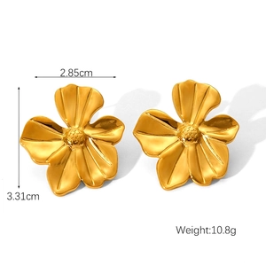 Macro shot of gold floral steel earrings with textured petals measuring 3.31 cm