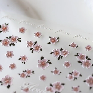 3D embossed cherry blossom nail art stickers with delicate pink flowers and green leaves