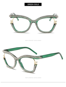 Detail of green cat-eye frames with pearl and rhinestone accents on gold metal temples