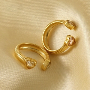 Detailed view of gold-plated bamboo texture heart earrings with sparkling zircon stones