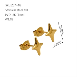 Macro detail of 18K gold PVD plated stainless steel star stud earrings showing 10.3mm size