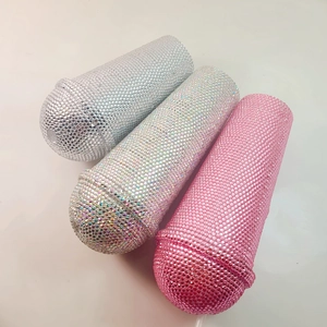 Detail showing shiny rhinestone-encrusted microphone shaped straw cups in silver and pink