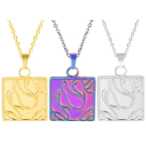 Detailed view of three square stainless steel pendants in gold, silver, and iridescent rainbow