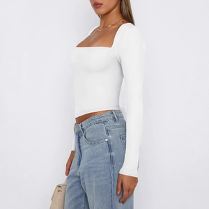 Slim fit white square neck long sleeve crop top for women shown from a side profile