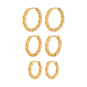 Three pairs of gold stainless steel twisted hoop earrings with textured hammered finish