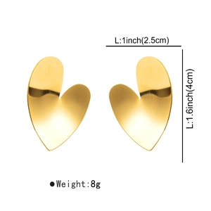 Detail of golden heart earrings showing 4cm by 2.5cm size measurements and 8g weight
