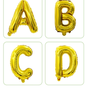Detail of glossy gold foil alphabet balloons A B C D for birthday party decorations