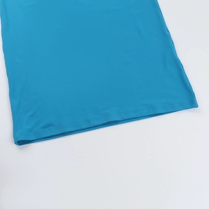 Detail of double-needle stitching on the hem of a blue mesh one-shoulder dress