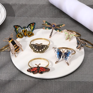 Set of 7 enamel insect napkin rings featuring colorful butterfly, dragonfly and bee designs