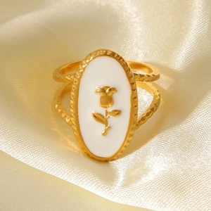 Elegant gold-plated stainless steel rose enamel ring on champagne satin background