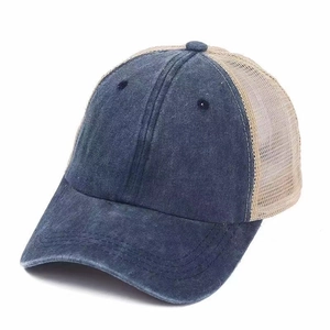 Classic blue denim trucker hat with beige mesh and a curved brim for outdoor sun protection
