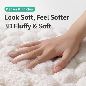 Thick white memory foam bath mat with quilted texture and soft absorbent surface
