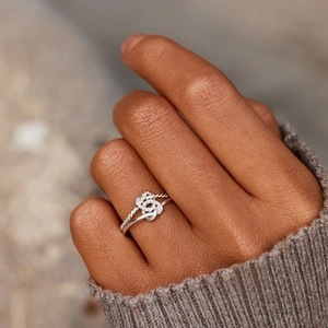 Minimalist s925 silver open ring featuring a double heart knot design for women