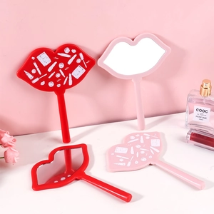 Lip-shaped handheld makeup mirrors in red and pink colors with sleek plastic frames
