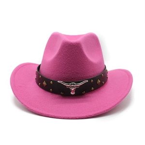 Detail of bright pink wool cowboy hat featuring a black leather band and silver bull skull