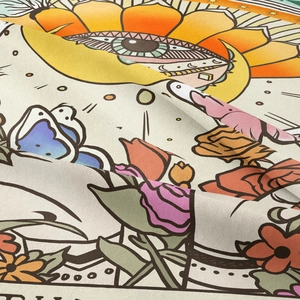 Detailed macro view of woven fabric texture with colorful butterfly and flower motifs