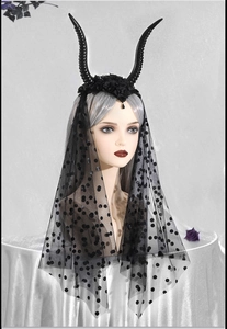 Close-up of Gothic black horn headband with rose details and polka dot mesh veil