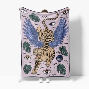 Detail of flannel blanket featuring artistic tiger illustration and tropical leaf patterns