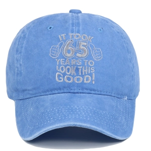 Detail of blue cotton baseball cap with silver 65 years birthday embroidery and thumb graphics