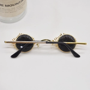 Creative gold vintage sunglasses with unique 3D eyelash frame and round black lenses