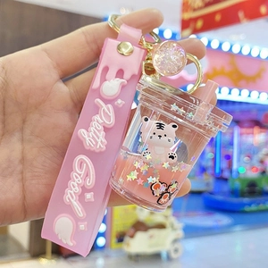 Pink tiger quicksand keychain with milk tea cup pendant and silicone strap hanging