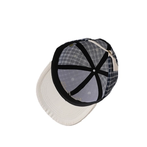 Adjustable plaid baseball cap for kids with blue and grey checkered crown and cream brim