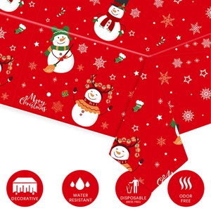 Close-up of waterproof red Christmas tablecloth with snowman and snowflake patterns
