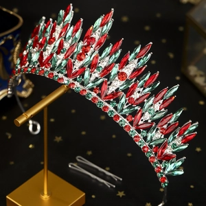 Luxurious Christmas crown with red and green rhinestones on a gold stand for party bridal hair