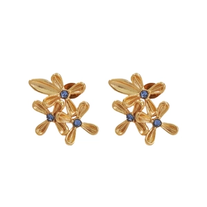 Elegant gold earrings with three-flower design and blue accents on white background