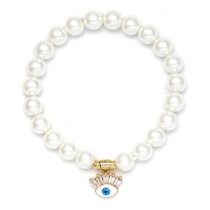 Detail of beaded evil eye bracelet with white faux pearls and a gold crystal charm pendant