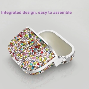 Detailed view of sparkly rhinestone AirPods case with rainbow crystals and silver trim