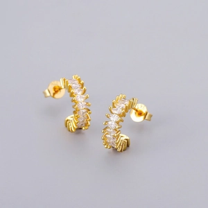 Macro shot of S925 sterling silver gold earrings featuring marquise-cut zircon stones