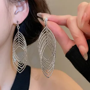 Exaggerated silver layered leaf drop earrings with zircon oval hollow design for women