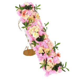Detail view of pink and champagne artificial rose and hydrangea floral row on metal stand