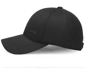 Detail view of black breathable baseball cap featuring sport emblem on textured fabric