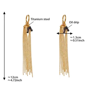 Detail view of 18k gold plated stainless steel letter K earrings with long beaded tassels