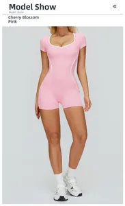 Detail of cherry pink sports bodysuit with white contrast piping and heart neckline