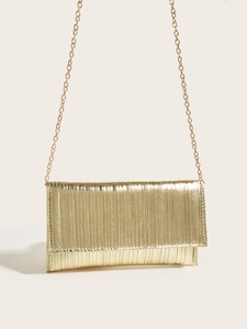 Close-up of gold pleated texture evening clutch with a sleek metallic chain strap