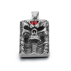 Gothic silver skull pendant with red gemstone eye in vintage stainless steel punk style