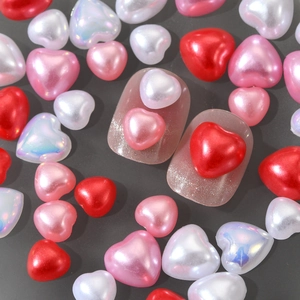 3D heart nail charms in red, pink, and pearl white for creative manicure designs