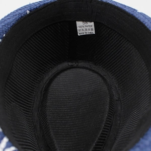 Internal view of Panama straw hat showing black lining and white 100% paper size label