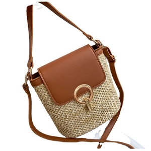 Minimalist straw beach bag with brown leather flap and golden round buckle for women